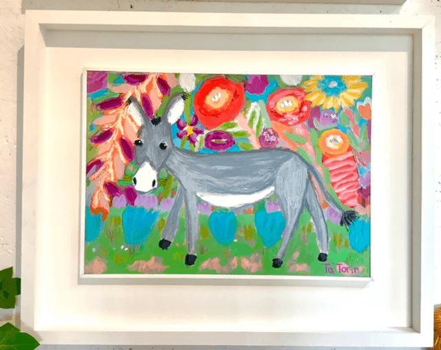 Donkey strolls through the flowers